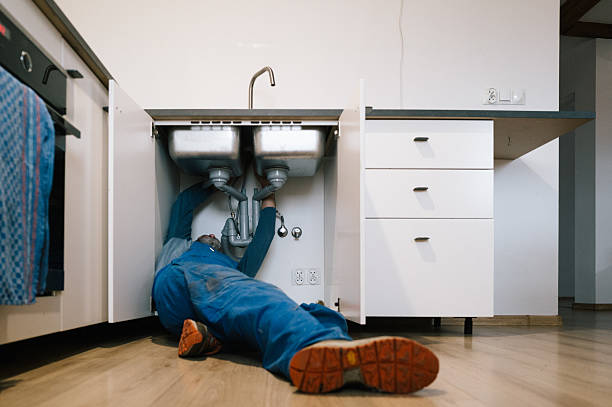 Professional Drain Cleaning technician working in Greenville, RI